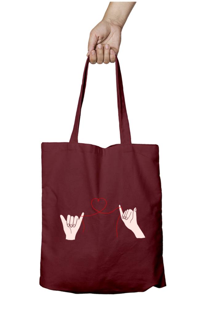 Unisex Tote Bag Zipper - two hands connected by a delicate red thread