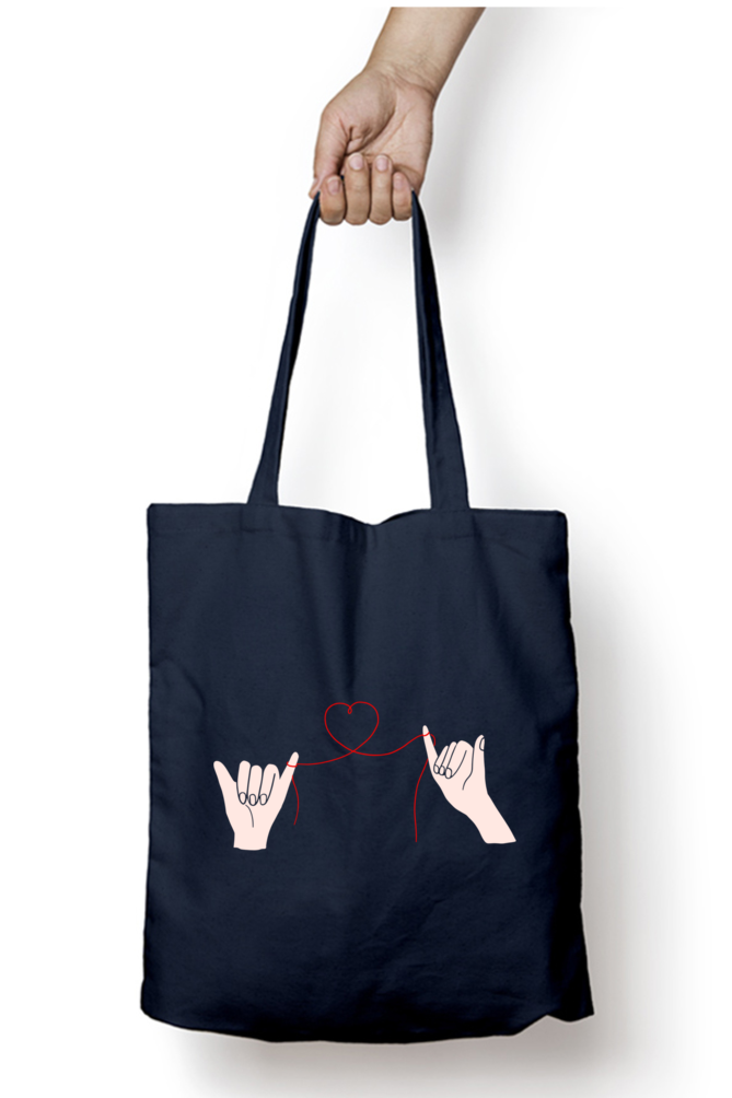 Unisex Tote Bag Zipper - two hands connected by a delicate red thread